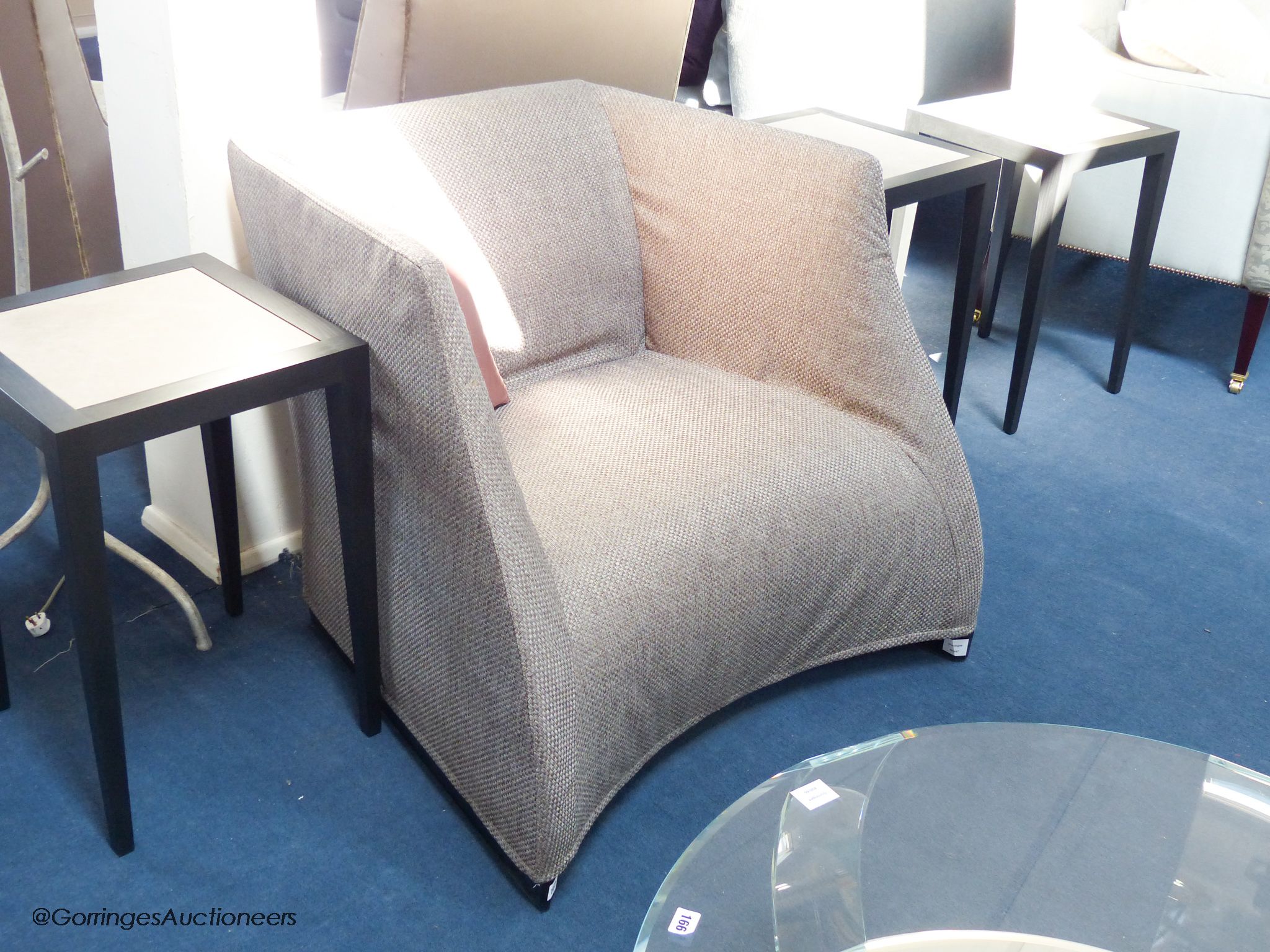 A contemporary upholstered armchair